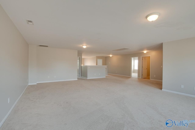 empty room featuring light carpet