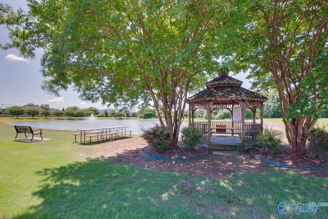 view of yard featuring a gazebo and a water view