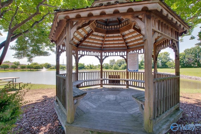 view of dock featuring a water view and a gazebo