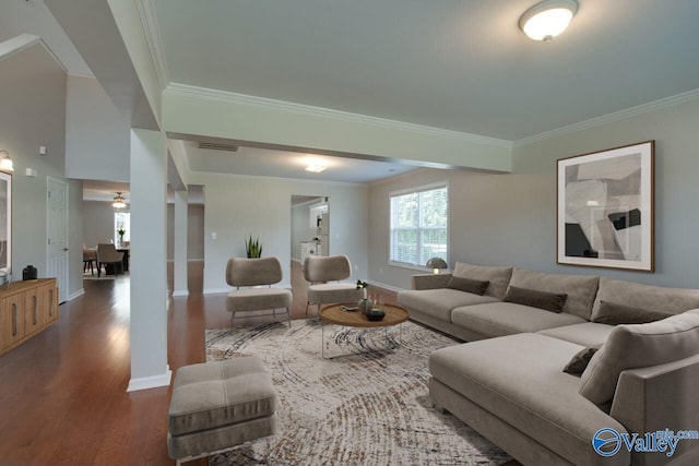 living room with ornamental molding and dark hardwood / wood-style floors