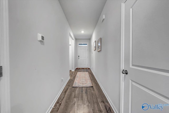 corridor featuring hardwood / wood-style floors