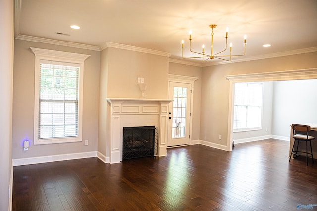 unfurnished living room with dark wood-type flooring, ornamental molding, and a chandelier