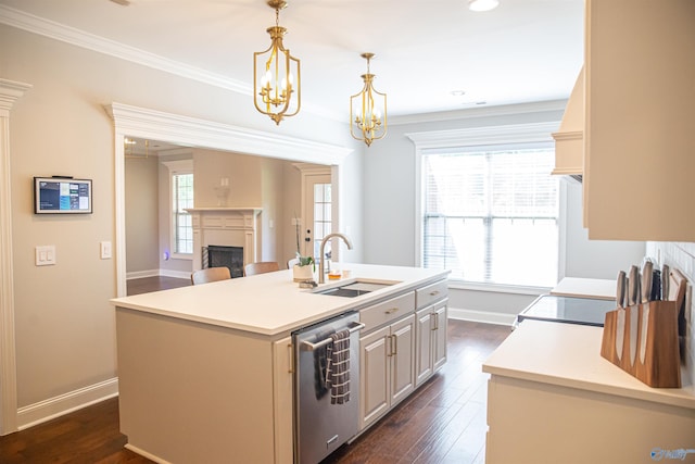 kitchen featuring pendant lighting, sink, dark hardwood / wood-style flooring, stainless steel dishwasher, and a center island with sink