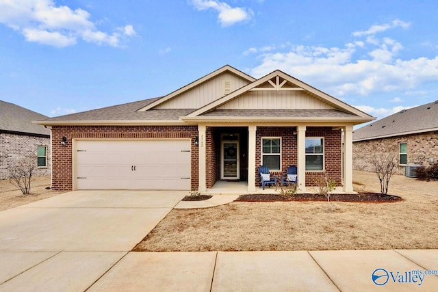 view of front facade with a garage and covered porch