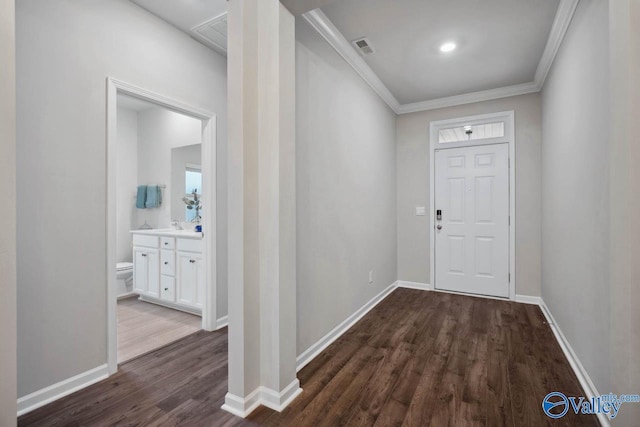 interior space featuring crown molding and dark hardwood / wood-style floors