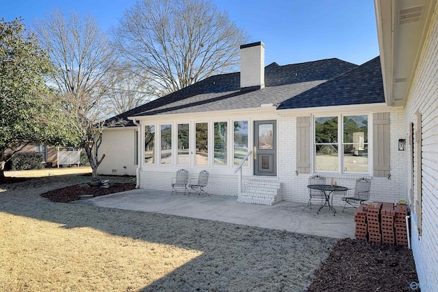 back of house with a patio