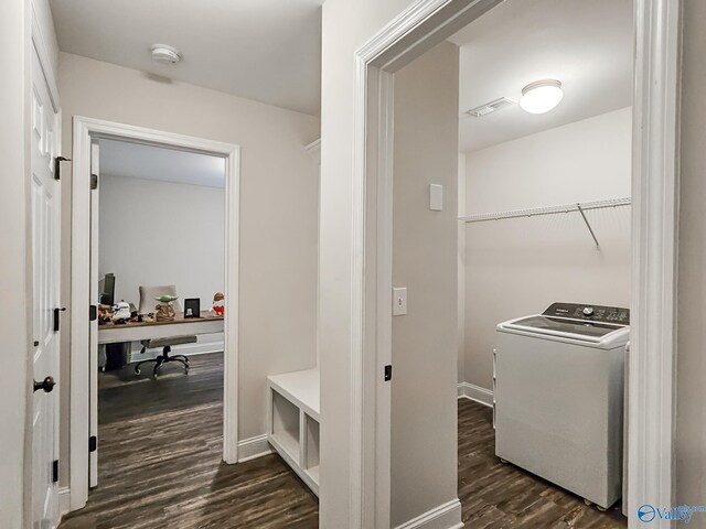 interior space with visible vents, baseboards, dark wood finished floors, laundry area, and washer / dryer