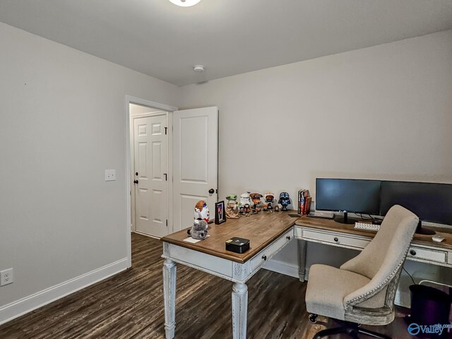 office area with baseboards and wood finished floors