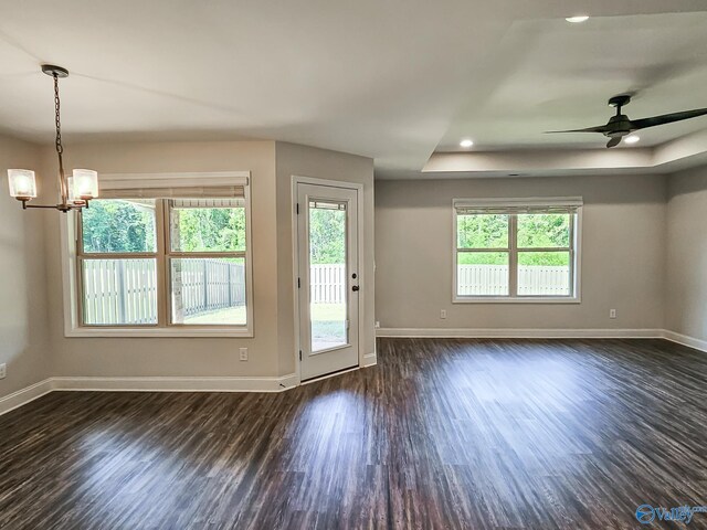interior space featuring baseboards and dark wood-style flooring