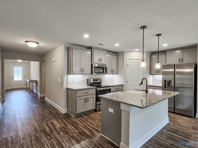 kitchen featuring a sink, stainless steel appliances, gray cabinetry, and visible vents