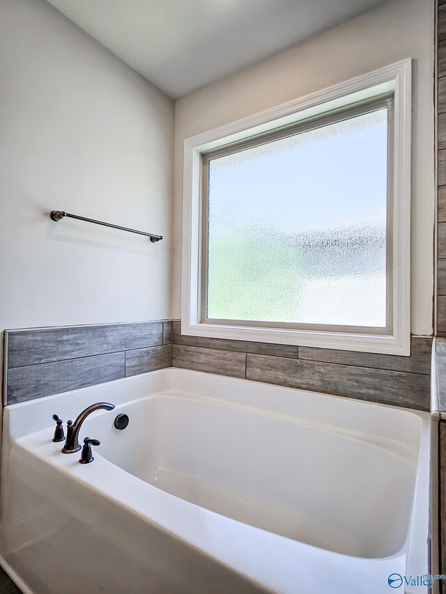 full bathroom featuring a bath
