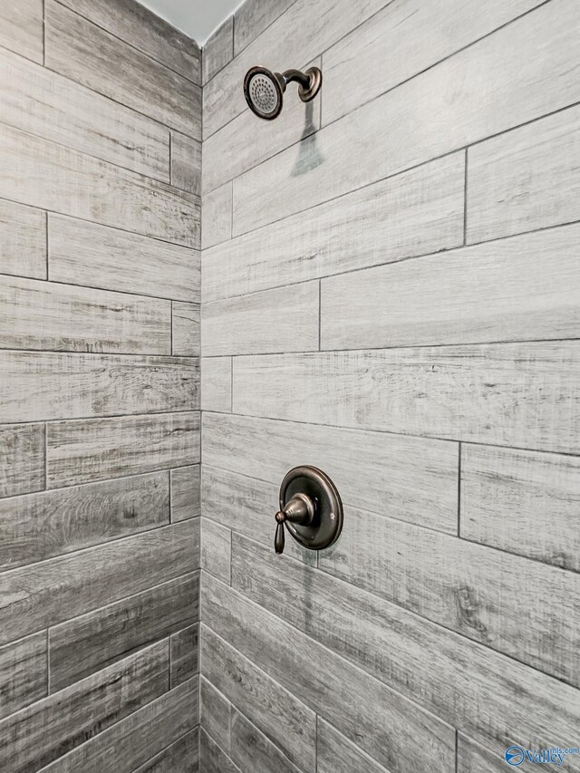 details with a tile shower
