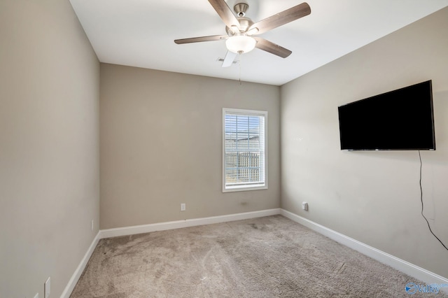 carpeted empty room with ceiling fan