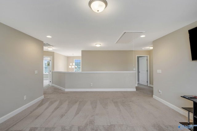 unfurnished room with light carpet