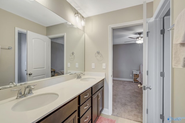 bathroom with ceiling fan and vanity