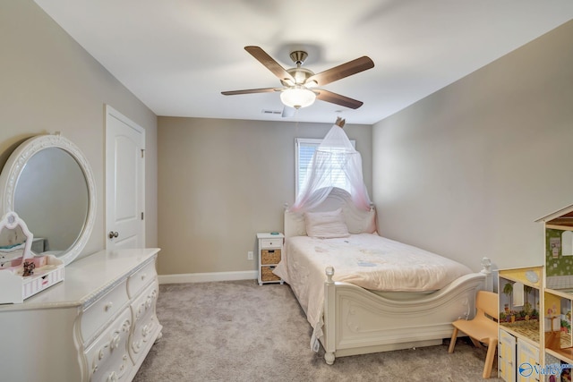 bedroom with ceiling fan and light carpet