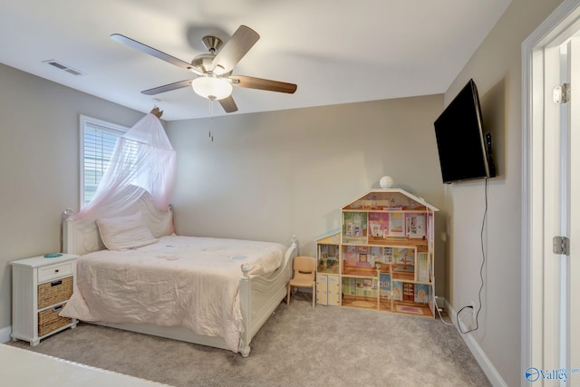 bedroom with light carpet and ceiling fan