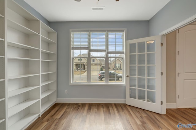 empty room with wood-type flooring