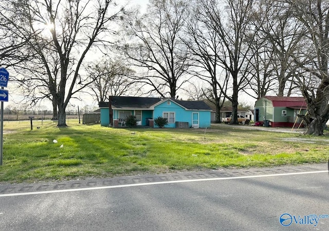 ranch-style home with a front yard