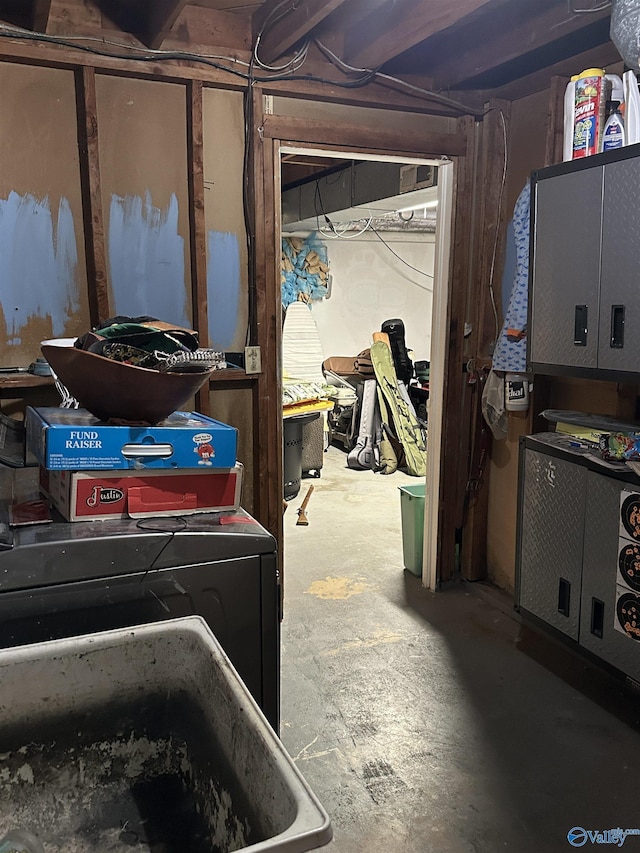 unfinished basement with independent washer and dryer