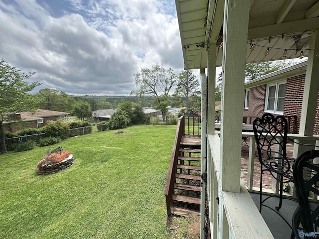 view of yard with a fire pit and stairs