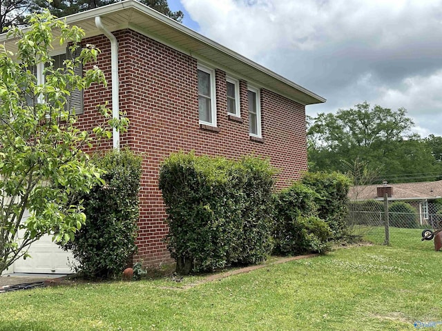 view of property exterior with brick siding