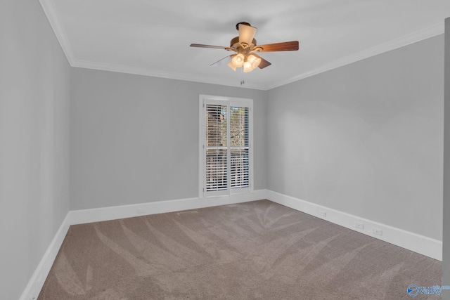 spare room featuring ceiling fan, baseboards, carpet, and ornamental molding