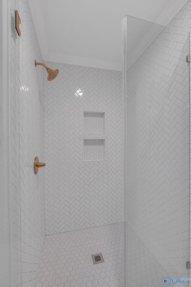 full bath with a tile shower