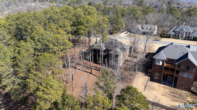 birds eye view of property with a forest view