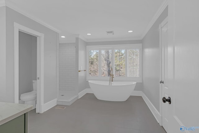 full bathroom featuring a shower stall, a freestanding bath, baseboards, and ornamental molding