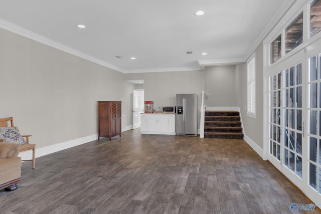 unfurnished living room with stairway, dark wood-style floors, baseboards, recessed lighting, and ornamental molding