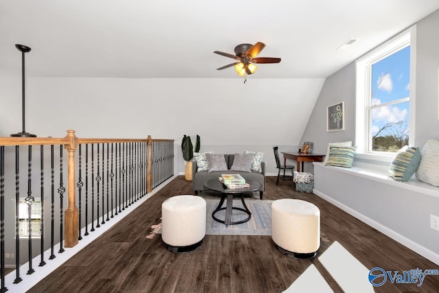sitting room with baseboards, a healthy amount of sunlight, wood finished floors, and a ceiling fan