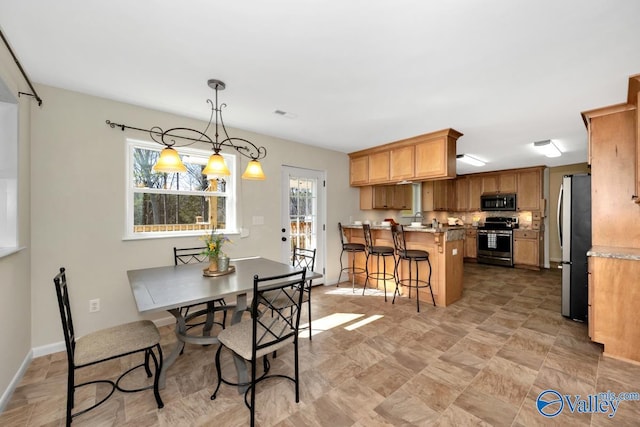 dining room featuring baseboards