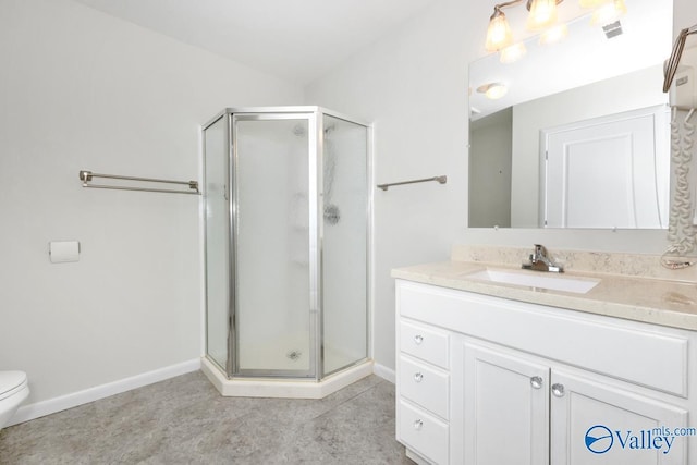 bathroom with visible vents, a shower stall, baseboards, toilet, and vanity