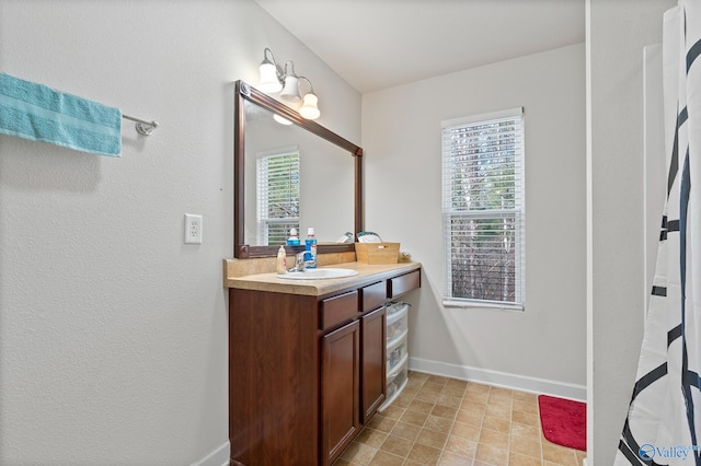 bathroom featuring vanity and plenty of natural light