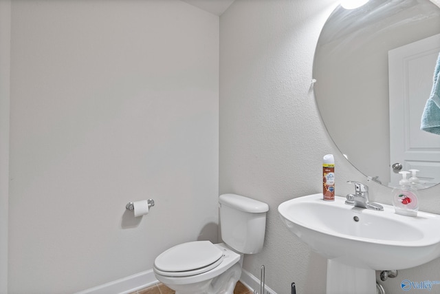 bathroom with sink and toilet