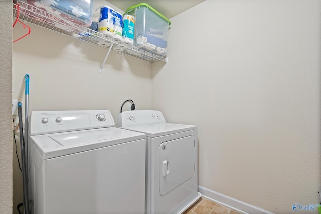 washroom with washer and dryer