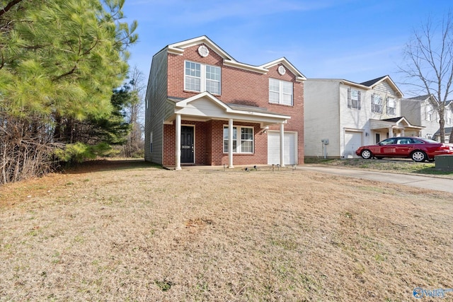 view of front of home with a garage, a front lawn, and covered porch