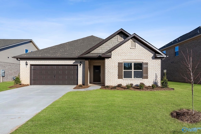 view of front of property featuring a garage and a front yard