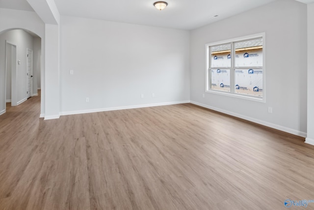 empty room with light hardwood / wood-style floors