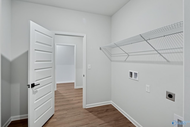 washroom featuring hardwood / wood-style floors, electric dryer hookup, and washer hookup