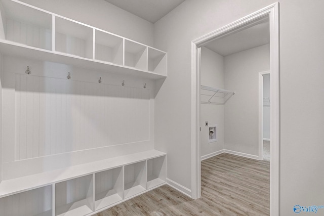 mudroom with light hardwood / wood-style floors