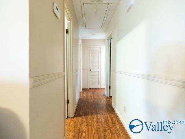 hallway featuring dark wood-type flooring