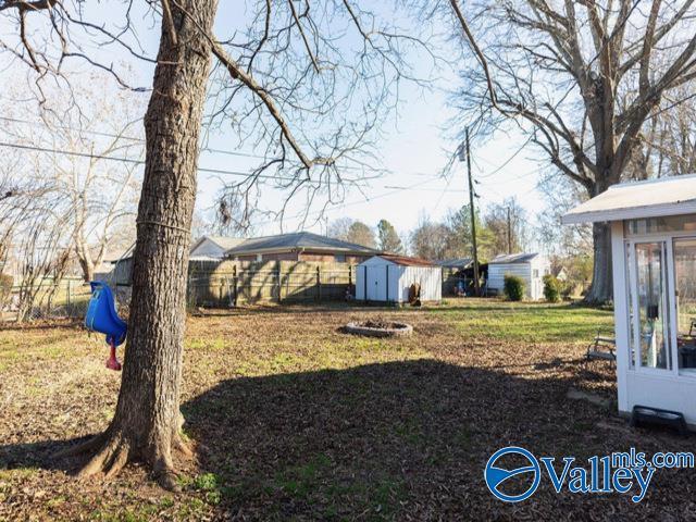 view of yard with a storage shed