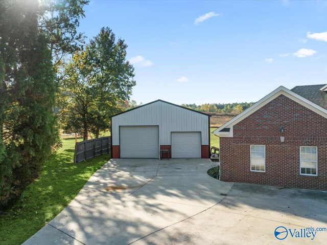 garage featuring a lawn