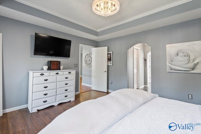 bedroom featuring ornamental molding and dark hardwood / wood-style floors