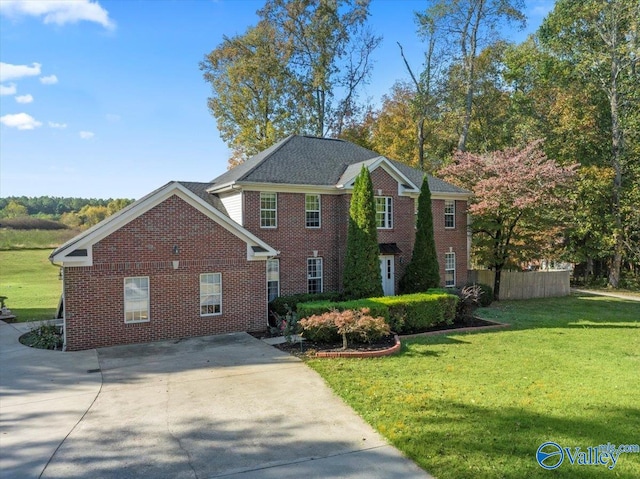 view of side of home featuring a yard