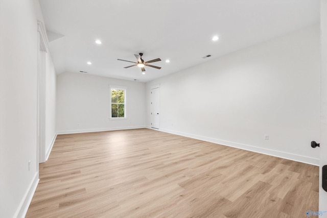 spare room featuring light hardwood / wood-style floors and ceiling fan