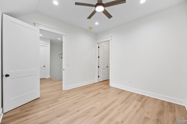 unfurnished bedroom with vaulted ceiling, light hardwood / wood-style flooring, and ceiling fan