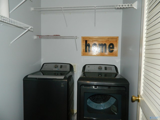 washroom with laundry area and independent washer and dryer